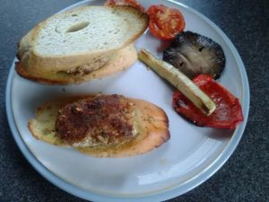 Turkey burgers on garlic bread with roast veg